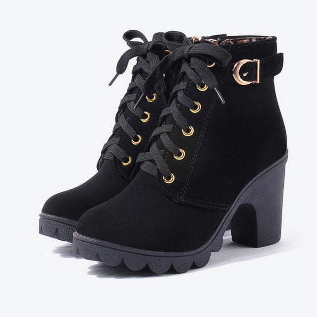 Women's black cross strappy boots