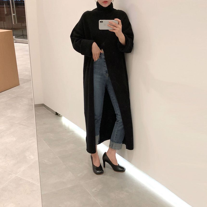 Women's black turtleneck sweater