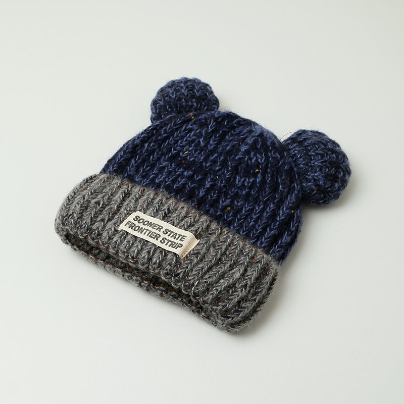 Women's navy blue knitted earmuff hat