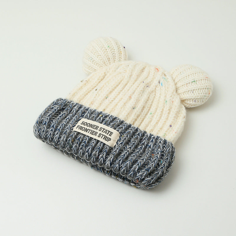 Women's creamy white knitted earmuff hat