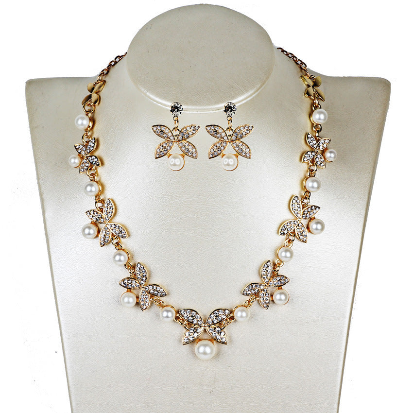 Women's gold pearl butterfly bridal set