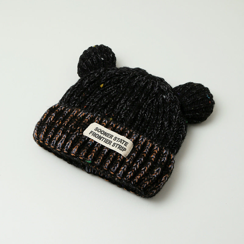 Women's black knitted earmuff hat