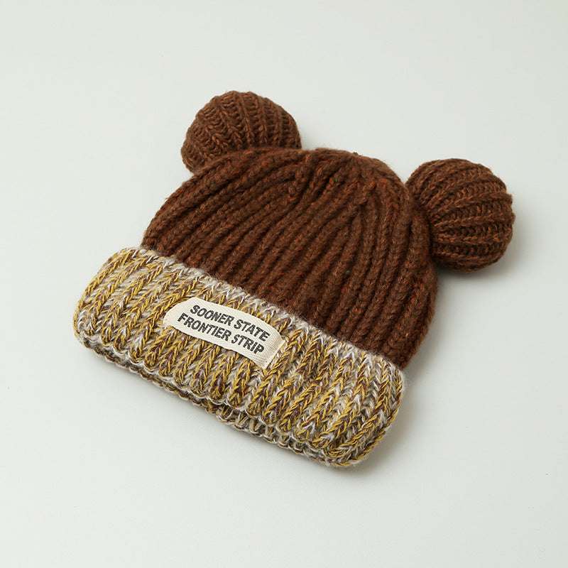 Women's brown knitted earmuff hat