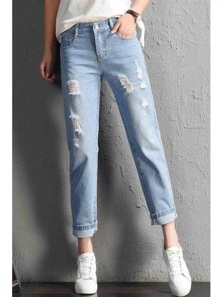 Women's light blue mid-rise ripped jeans