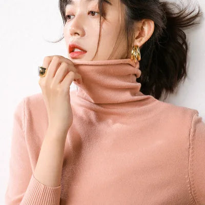Women's pink turtleneck sweater