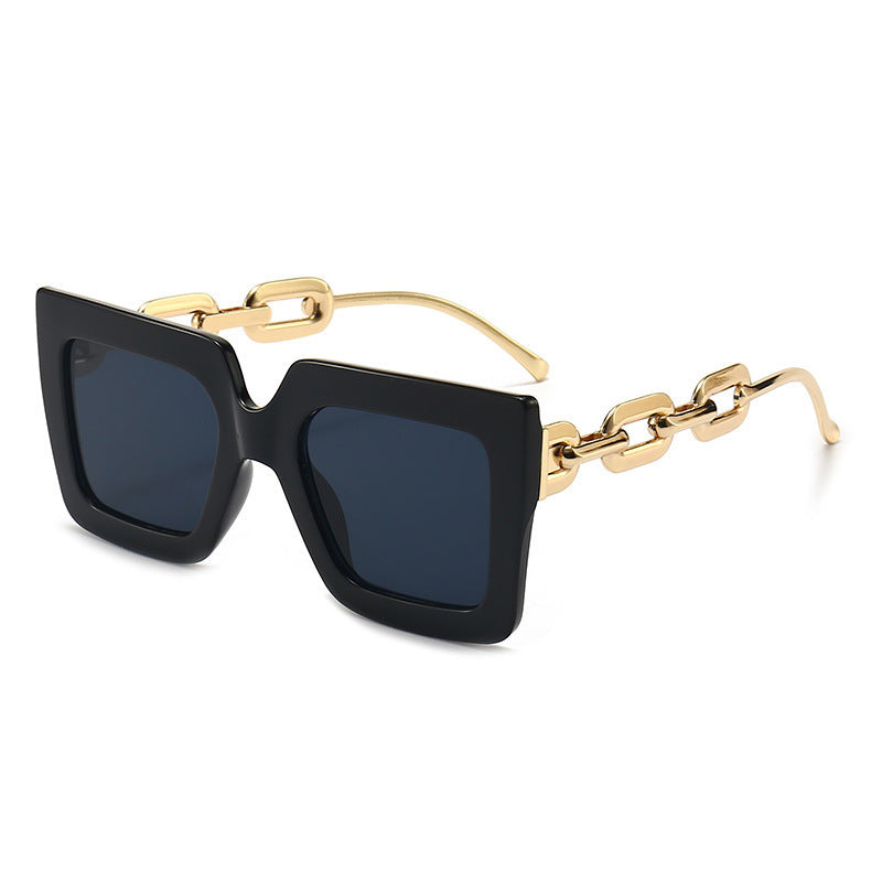 Women's black frame gray piece sunglasses